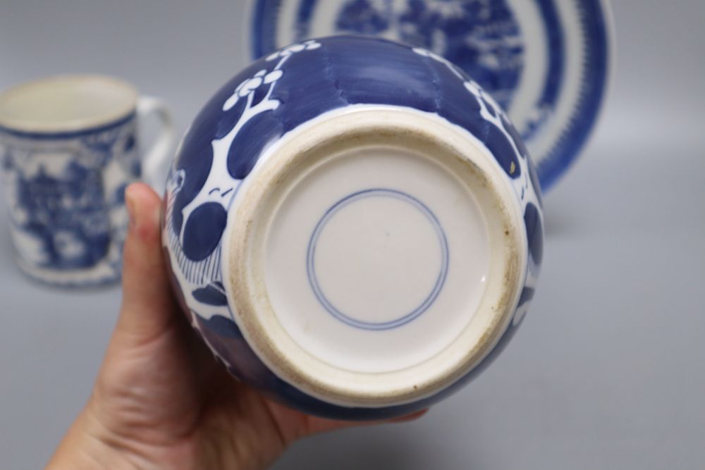 Five pieces of Chinese ceramics including two blue and white plates, a Canton plate, a blue and white mug and a prunus jar and cover,